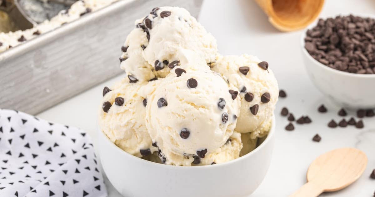 close up shot of scoops of Cookie Monster ice cream in a white bowl