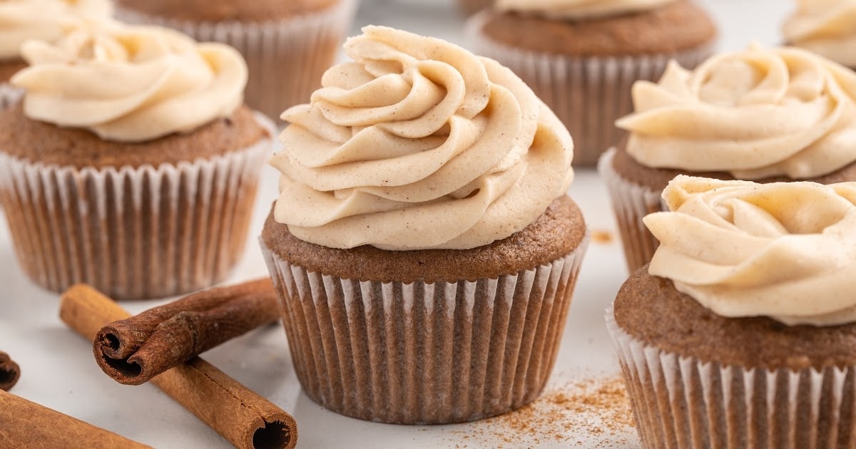 cupcakes topped with Cool Whip Frosting on a wooden tray