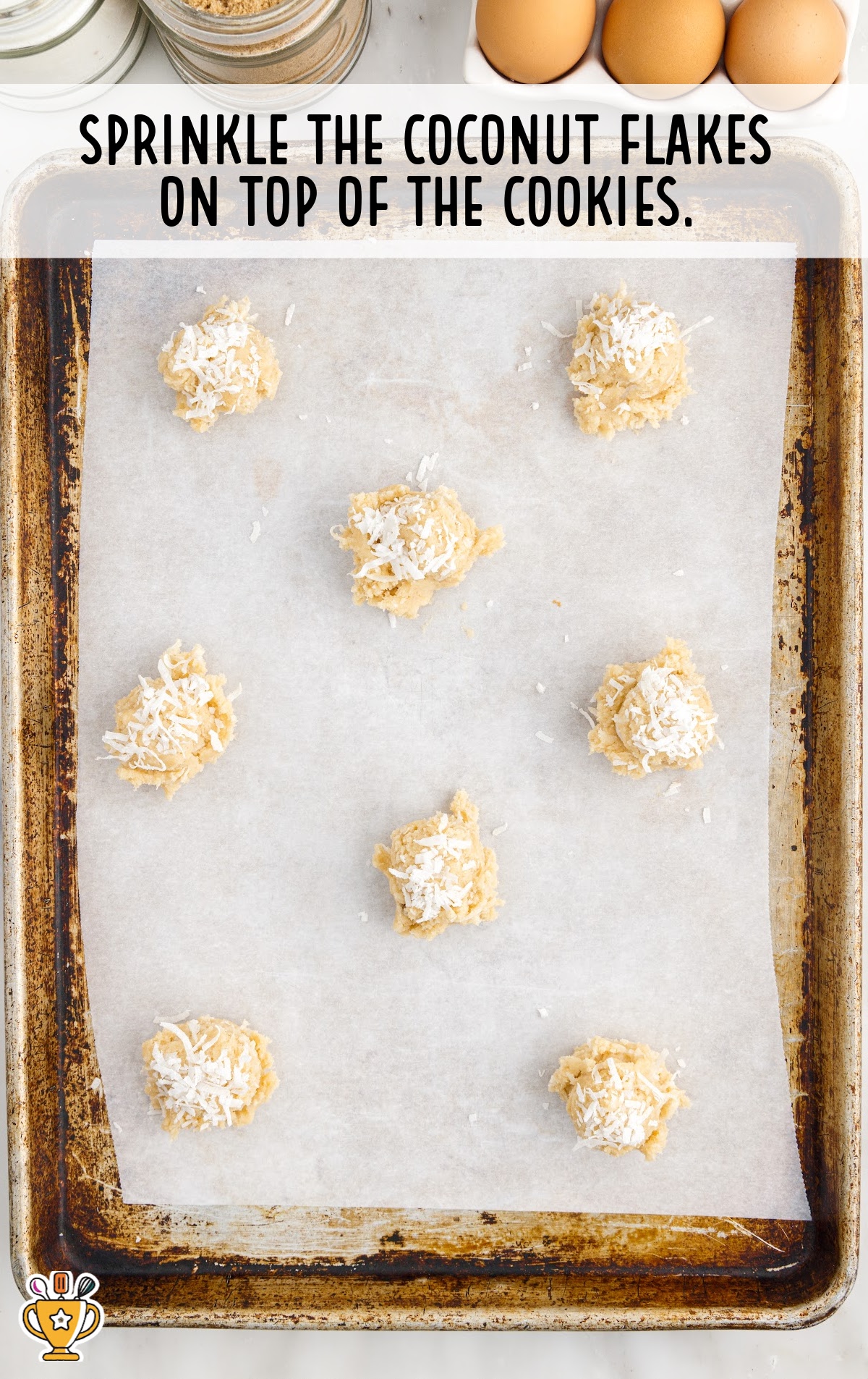 coconut flakes sprinkled on top of the cookies