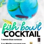 Bright blue fish bowl cocktail with blue cura&ccedil;ao, coconut rum, vodka, Sprite, lime slices, Swedish Fish candy, and colorful drink umbrellas.