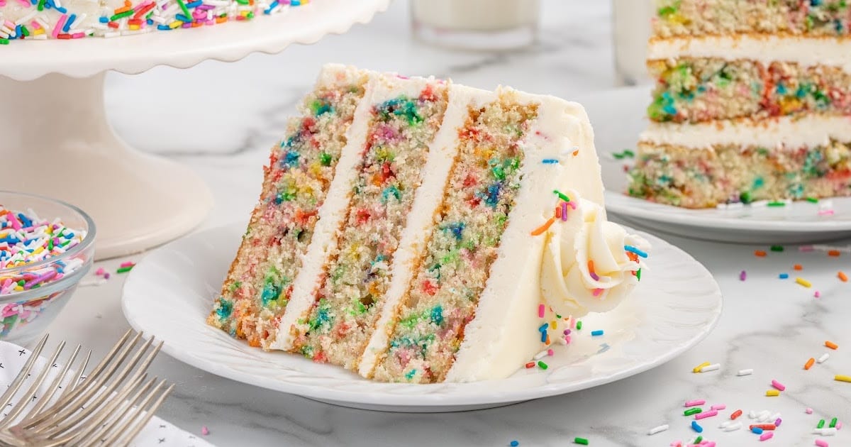 a slice of Funfetti Cake on a plate