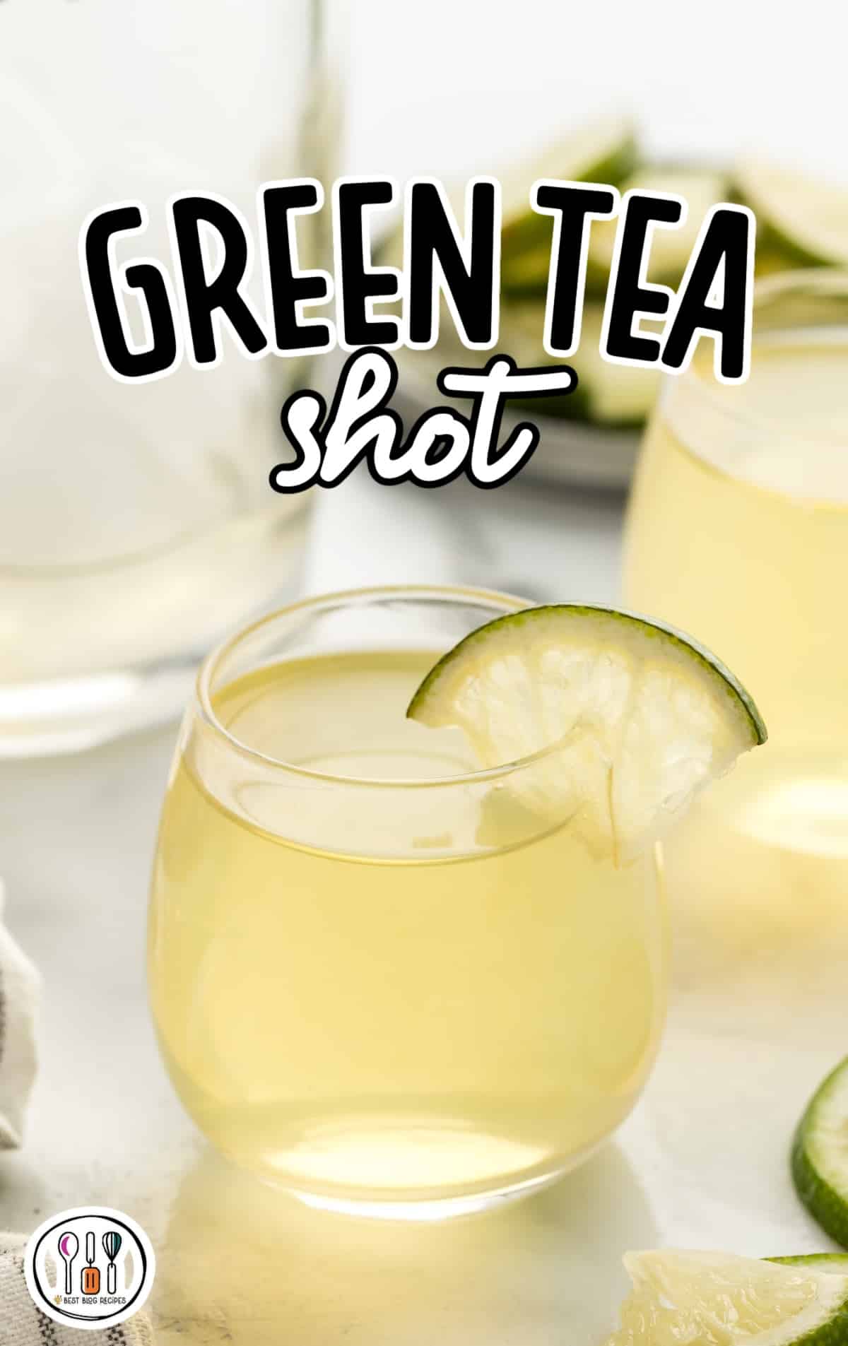 a close up shot of Green Tea Shot in a glass cup garnished with a slice of lime