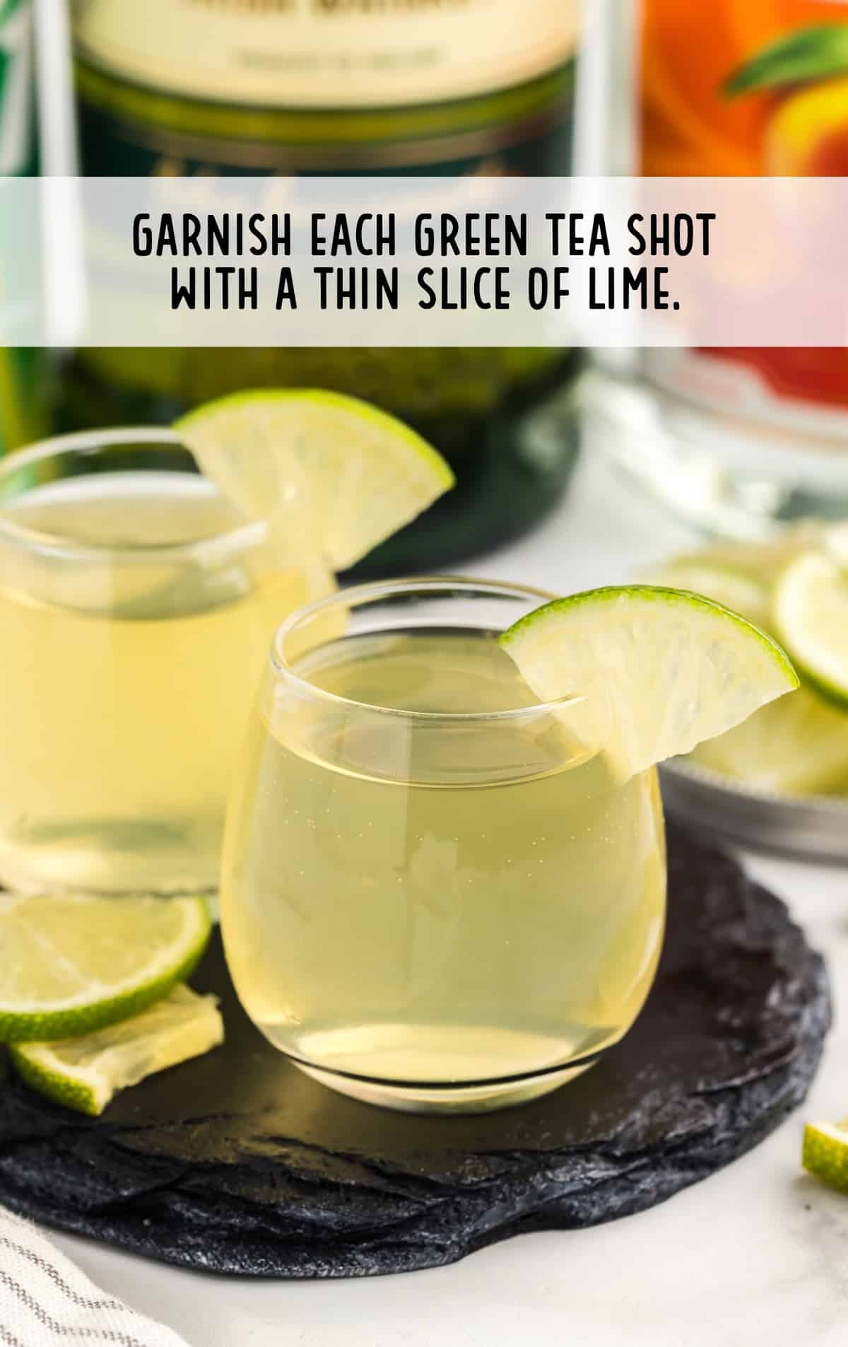 tea shot garnished with slice of lime