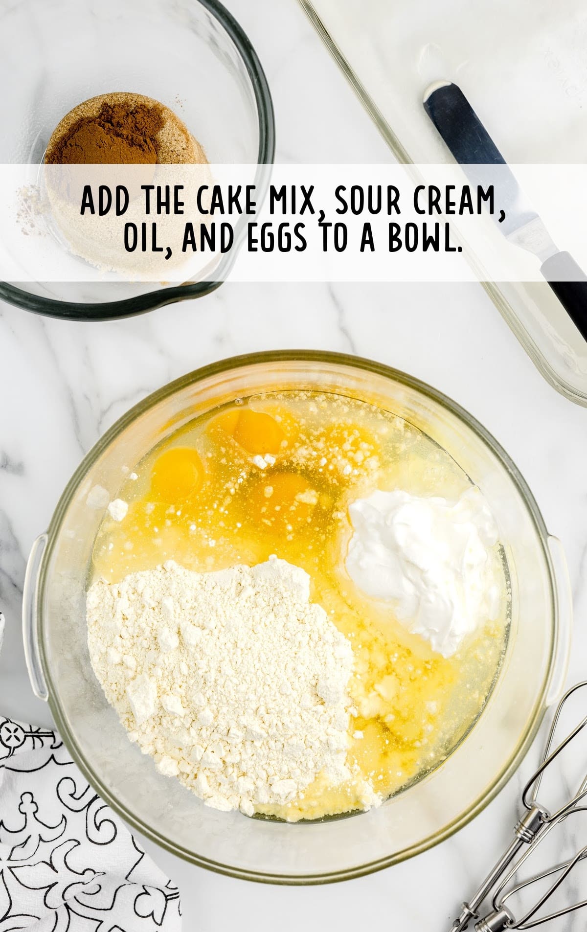 cake mix, sour cream, vegetable oil, and eggs combined in a bowl