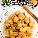 overhead shot of a plate of Honey Walnut Shrimp garnished with scallions and served over white rice