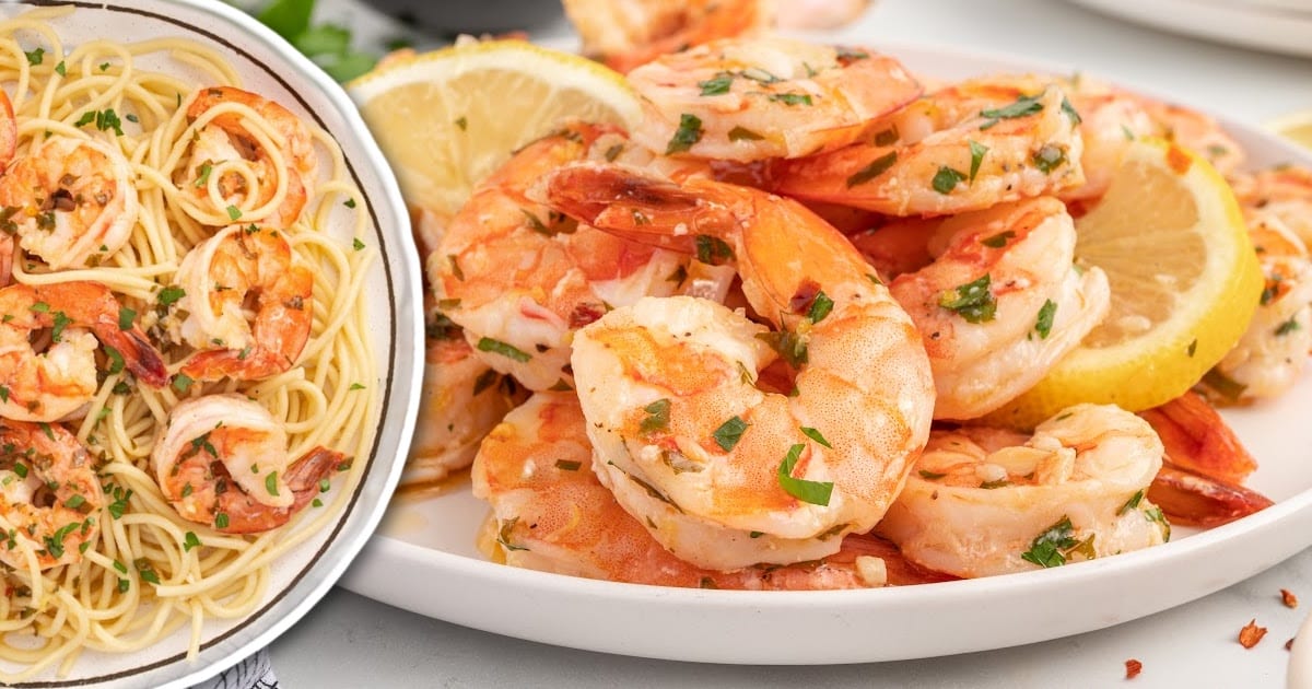 shrimp and lemon slices garnished with parsley on a serving tray