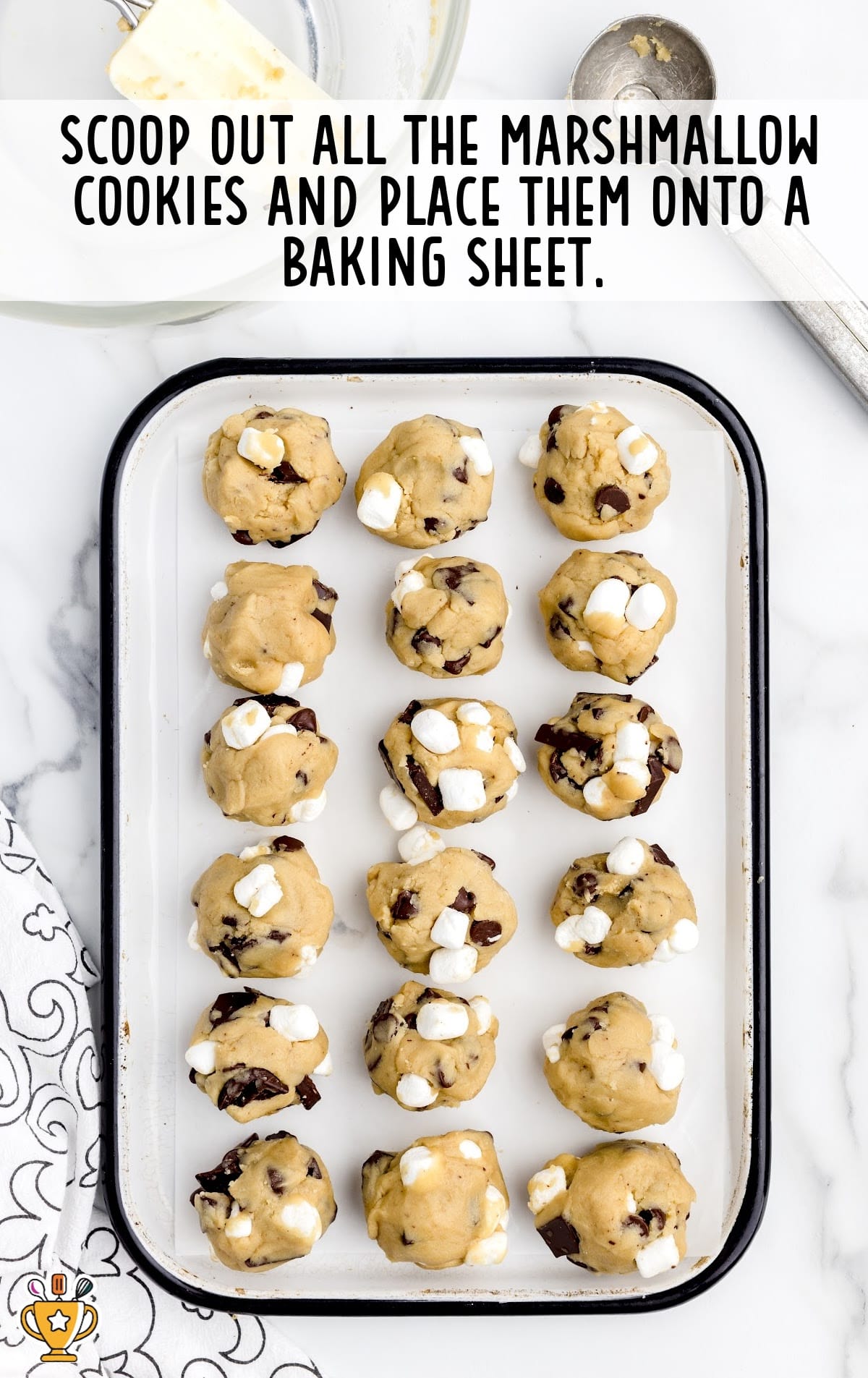 marshmallow scooped out and placed onto a baking sheet