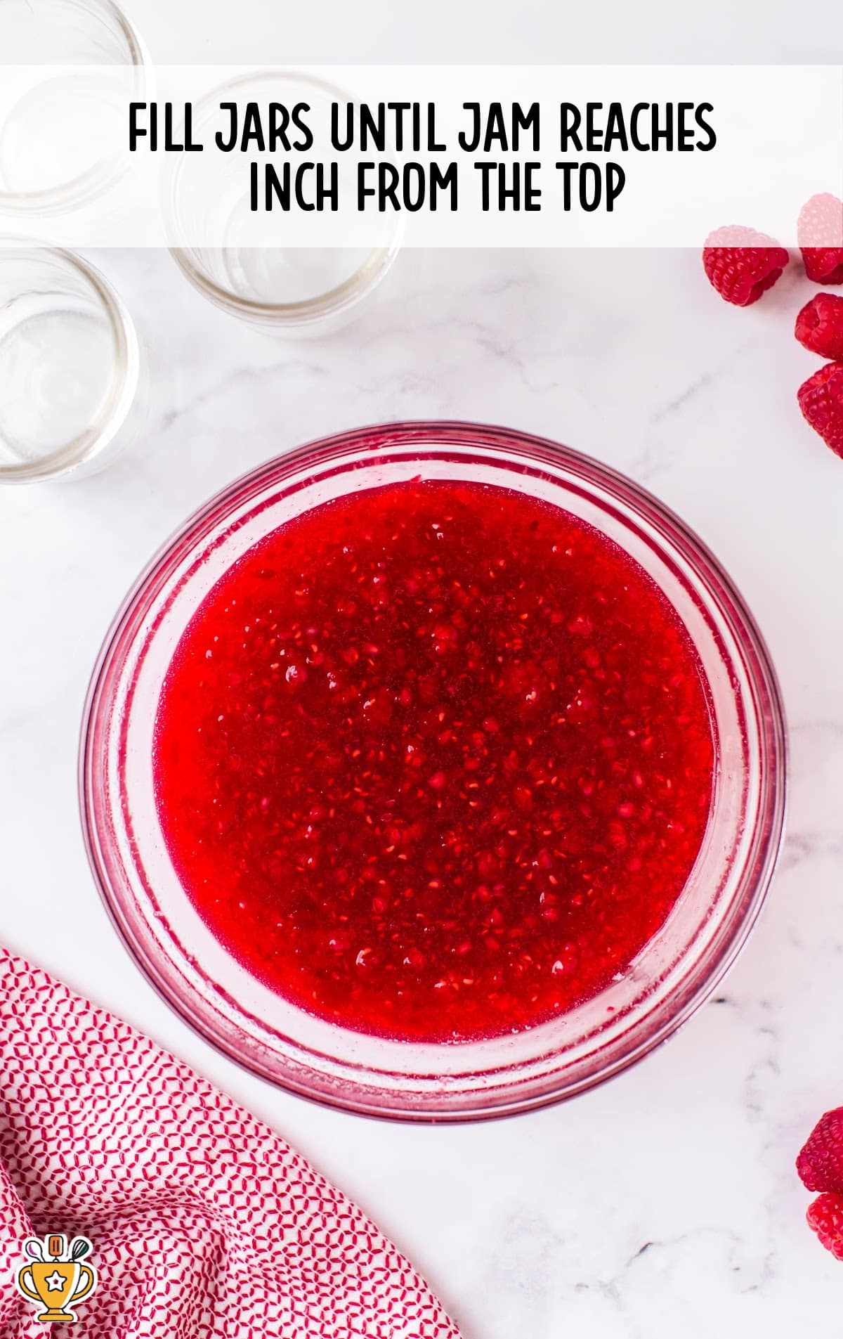close up shot of a jar of Raspberry Freezer Jam in a mason jar