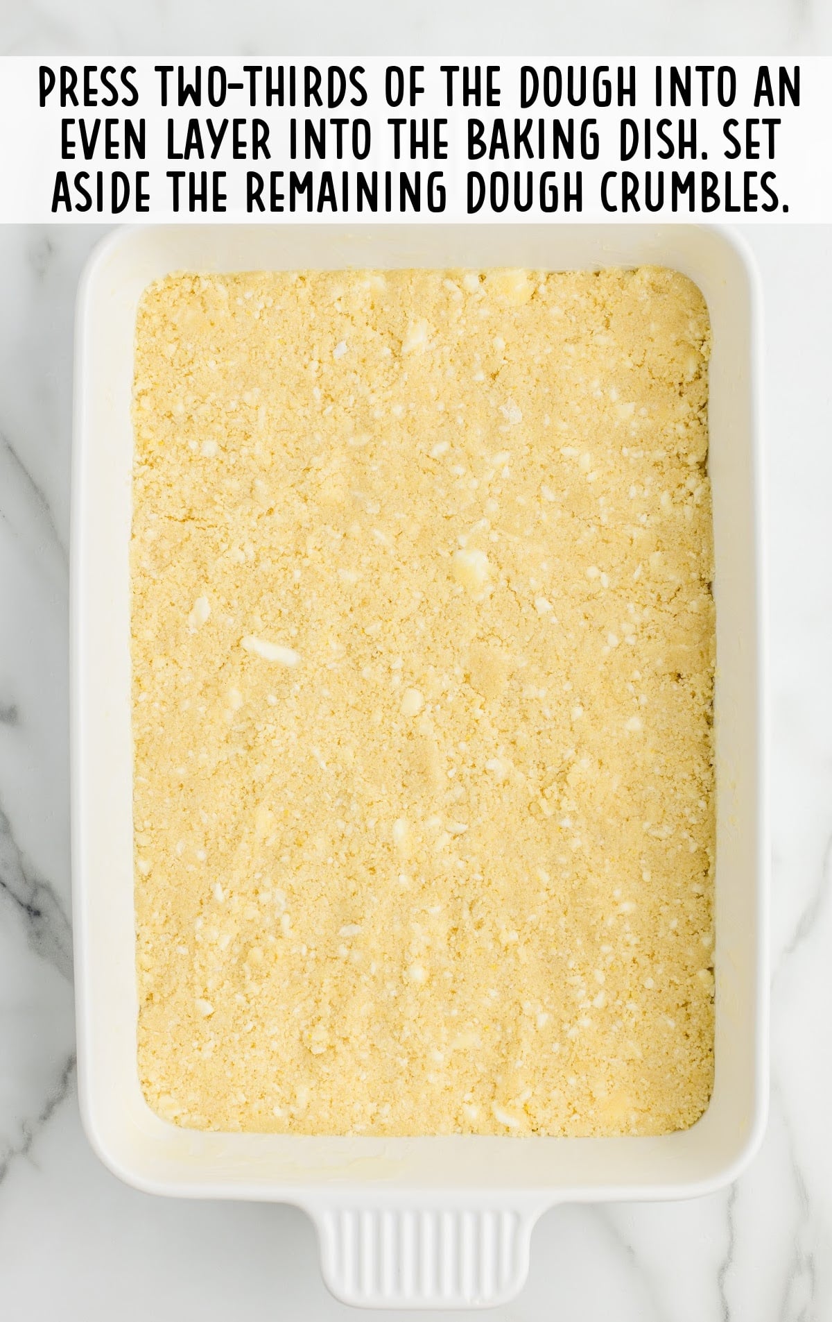 dough pressed into the bottom of the baking dish