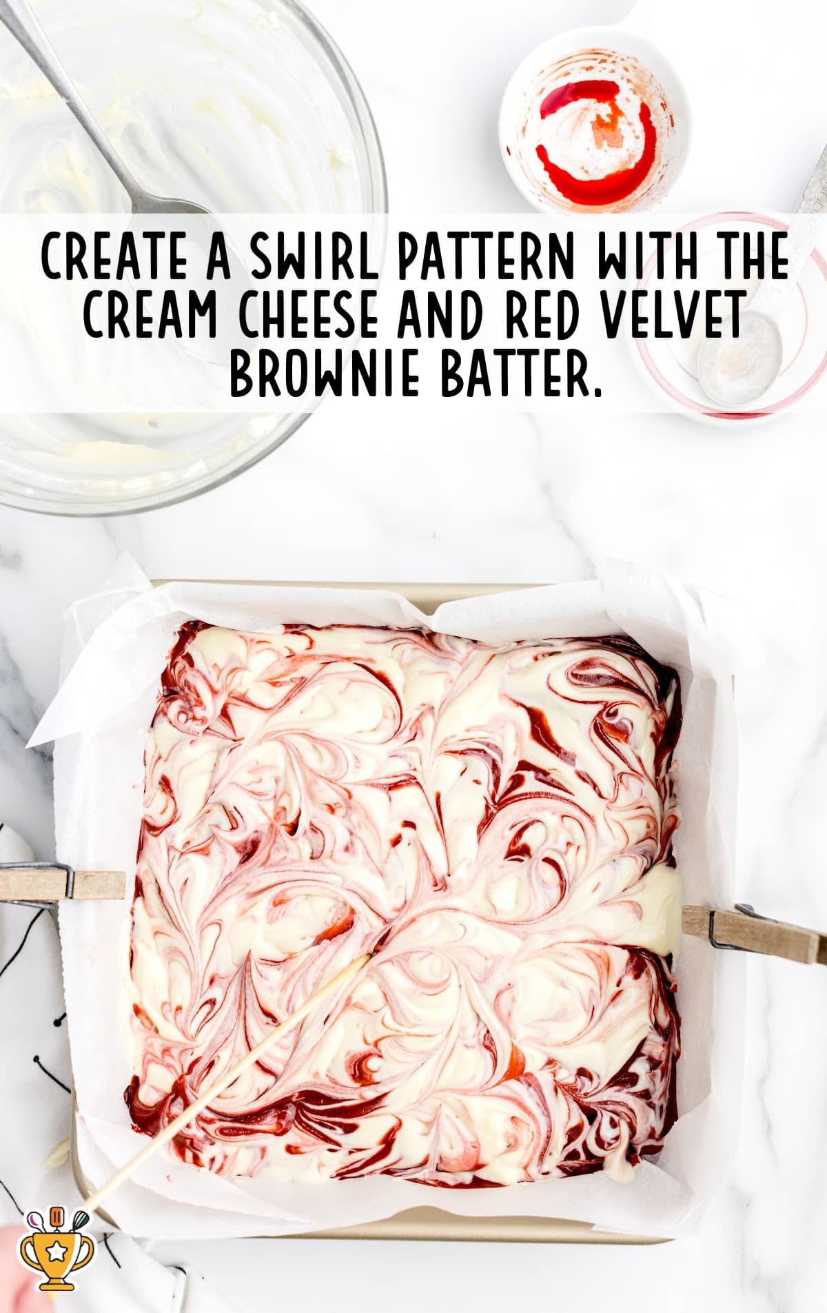 swirl patterns created with the cream cheese and red velvet brownie batter