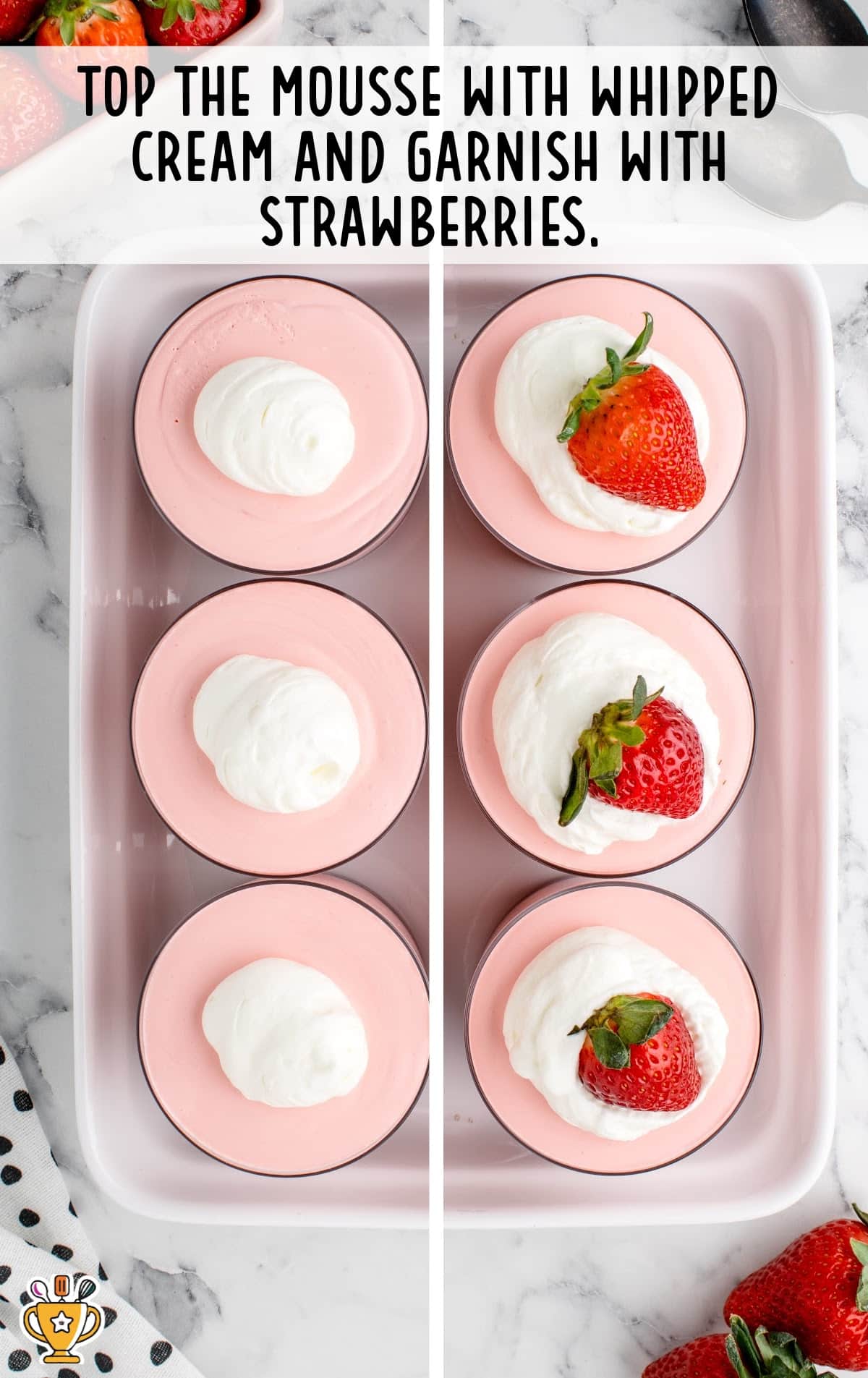 mousse topped with whipped cream and garnished with strawberries