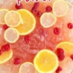 close up shot of Party Punch with lemon slices and raspberries