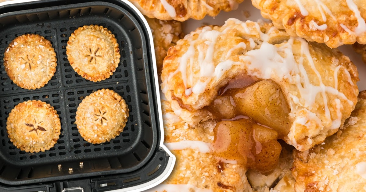 close up shot of a bunch of Air Fryer Apple Pies with a bite taken out of one of them