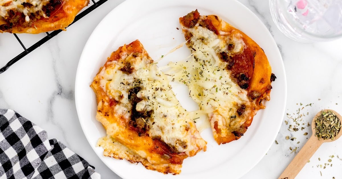 slice of Air Fryer Pizzas on wooden board