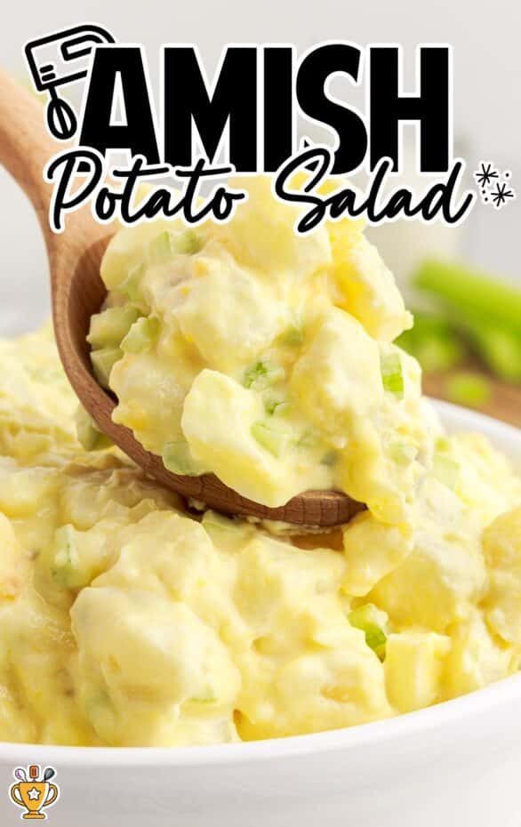 overhead shot of Amish Potato Salad in a bowl with a wooden spoon