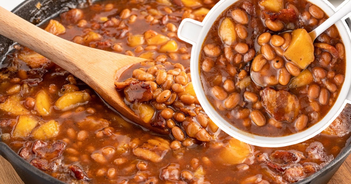 a bowl of Apple Pie Baked Beans with a spoon