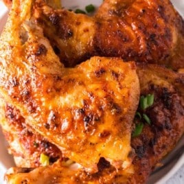 Baked chicken on a serving plate.