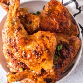 Baked chicken legs on a serving plate