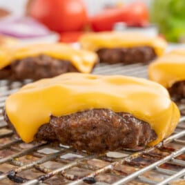 Close up of baked hamburgers on a baking tray