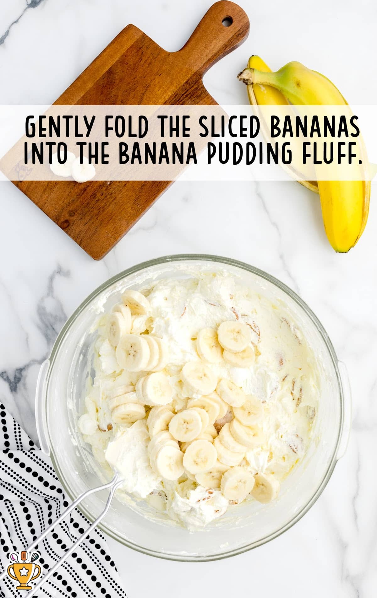 sliced bananas folded into the banana pudding fluff