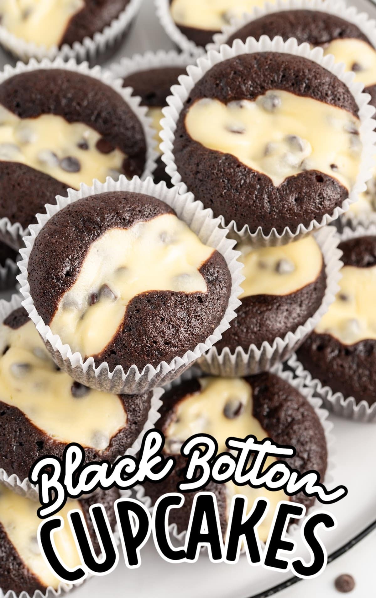 a close up shot of Black Bottom Cupcakes stacked on top of each other.