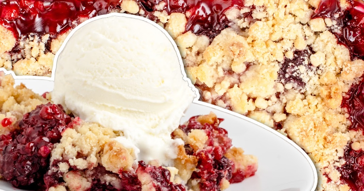 close up shot of a serving of peach dump cake topped with whipped cream