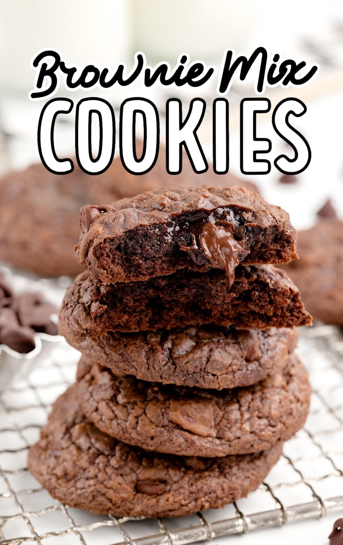 close up shot of Brownie Mix Cookies stacked on top of each other with one split in half