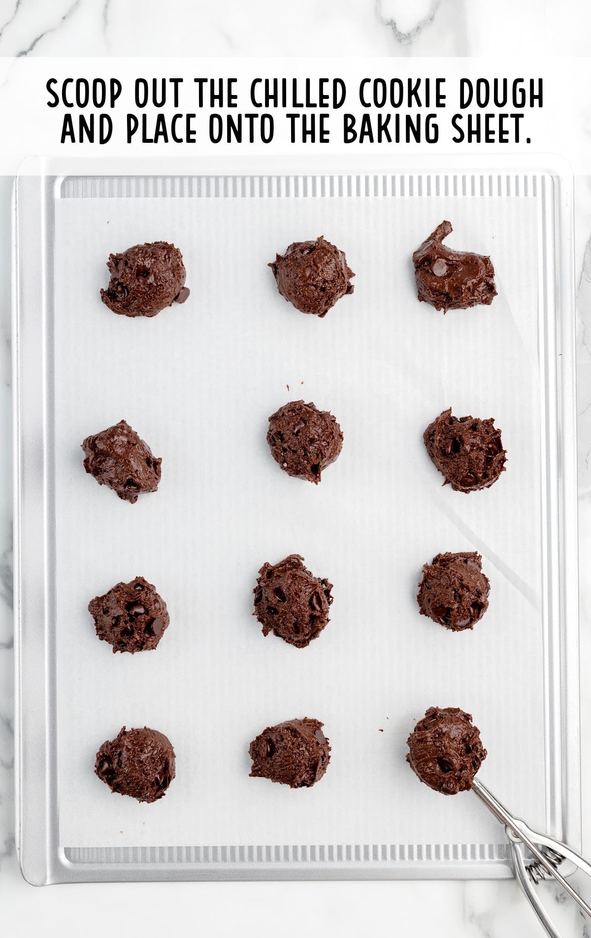 cookie dough scooped out and placed onto the baking sheet