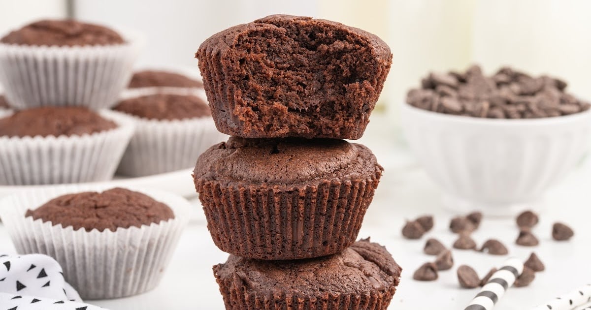 a close upshot of Brownie Muffins stacked on top of each other on a plate