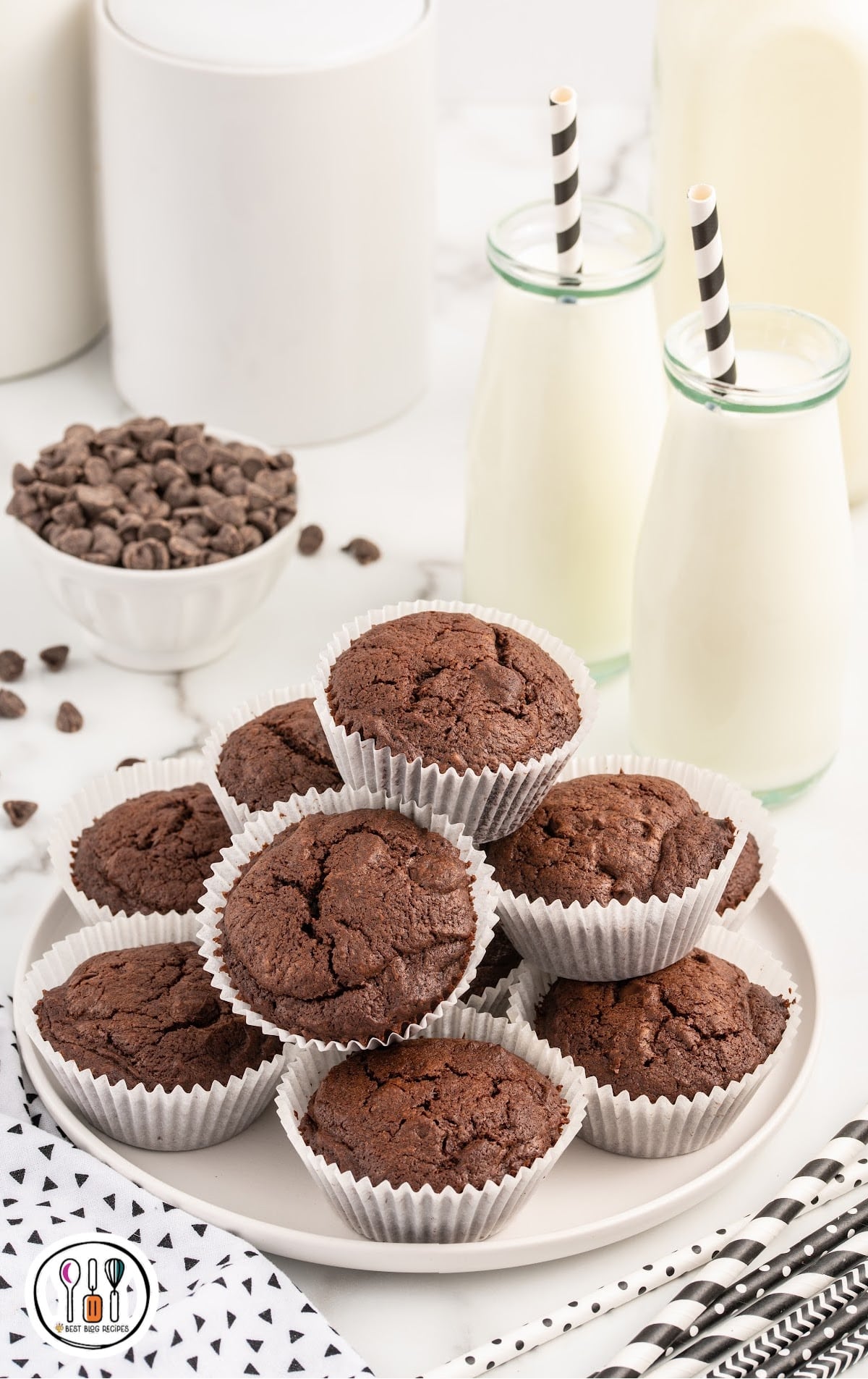 a close upshot of Brownie Muffins stacked on top of each other on a plate