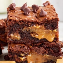 a stack of gooey caramel brownies