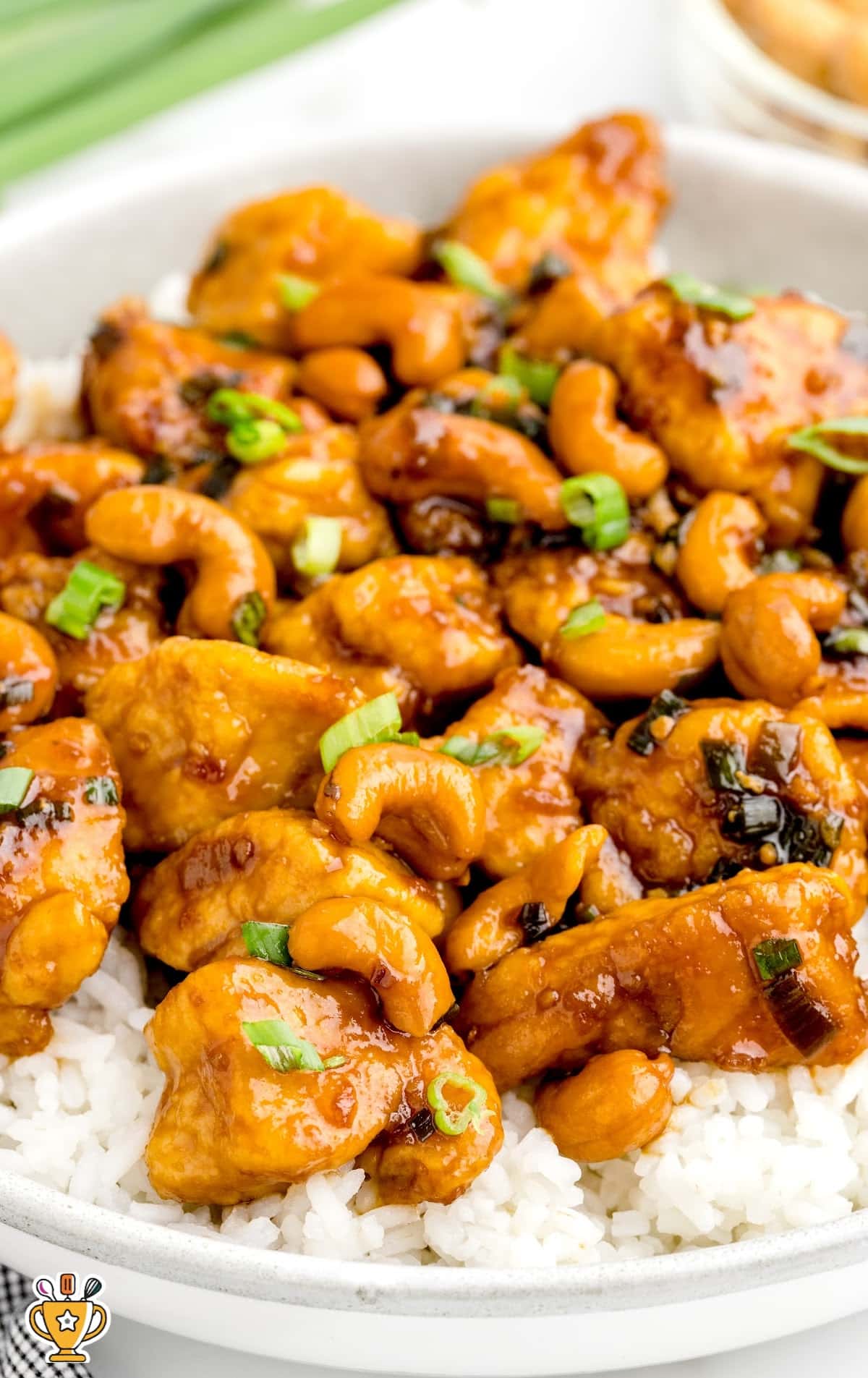 close up shot of a skillet full of Tuscan Chicken with a spoonful of sauce