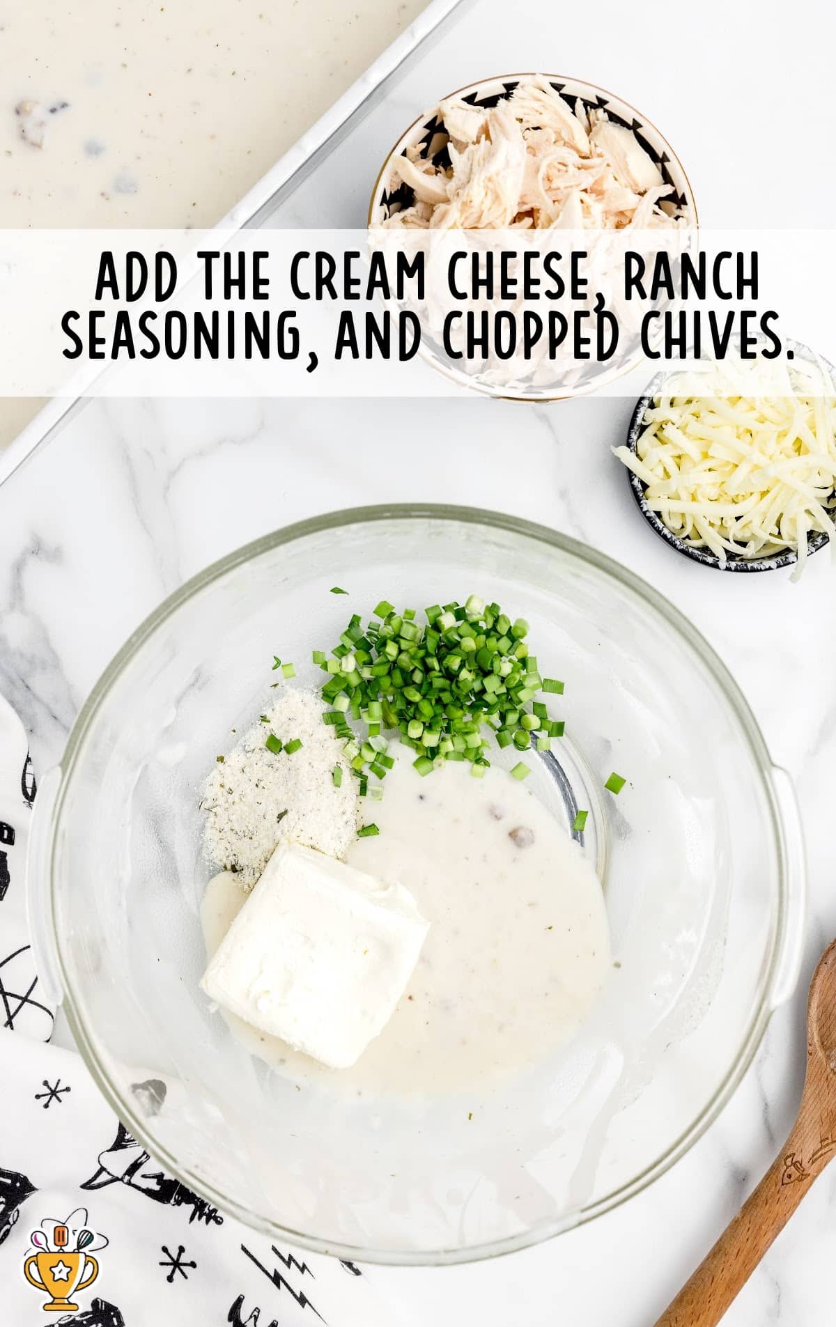 cream cheese, ranch seasoning, and chopped chives added to a bowl