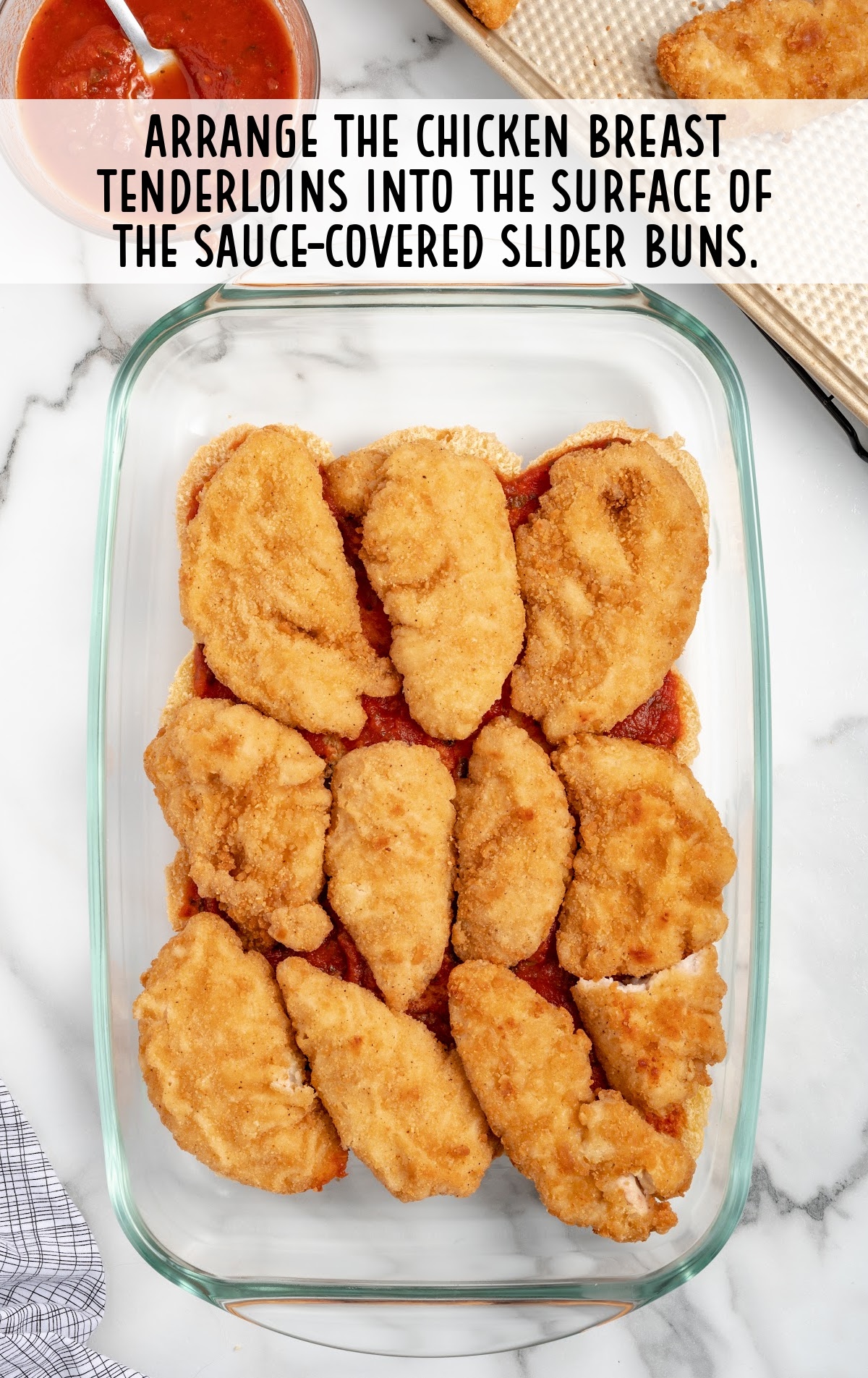 chicken breast tenderloins placed in a baking dish