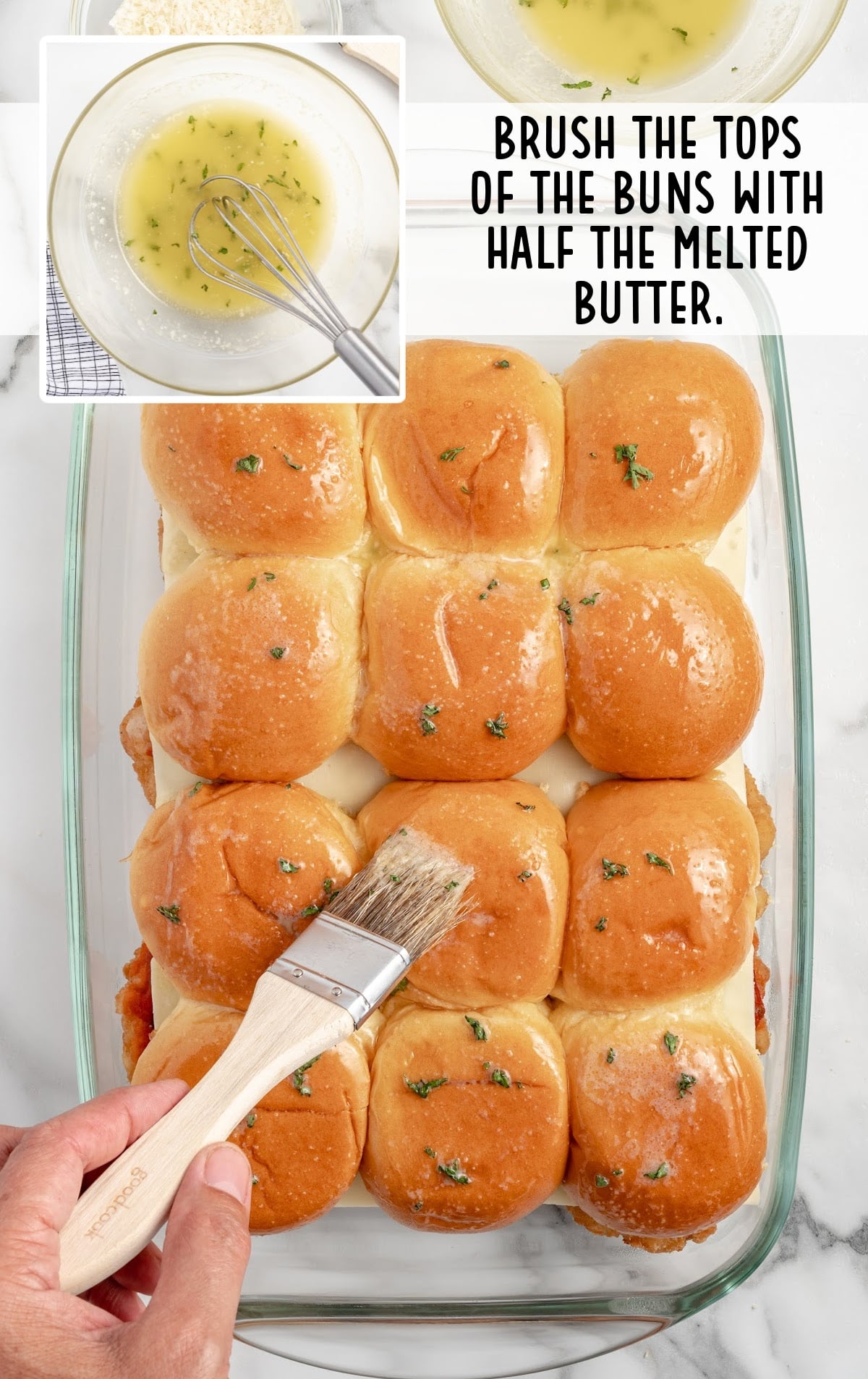 buns brushed with melted butter mixture in a baking dish