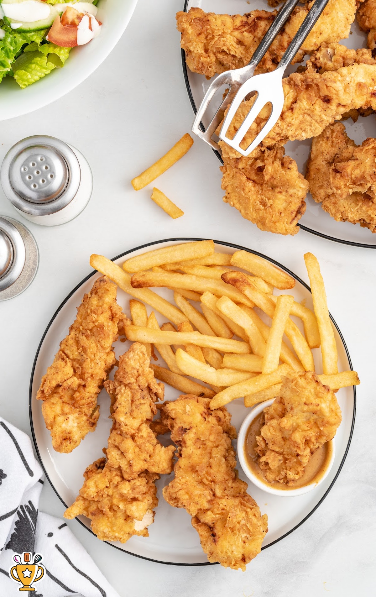 close up shot of a bunch of Chicken Tenders on a plate