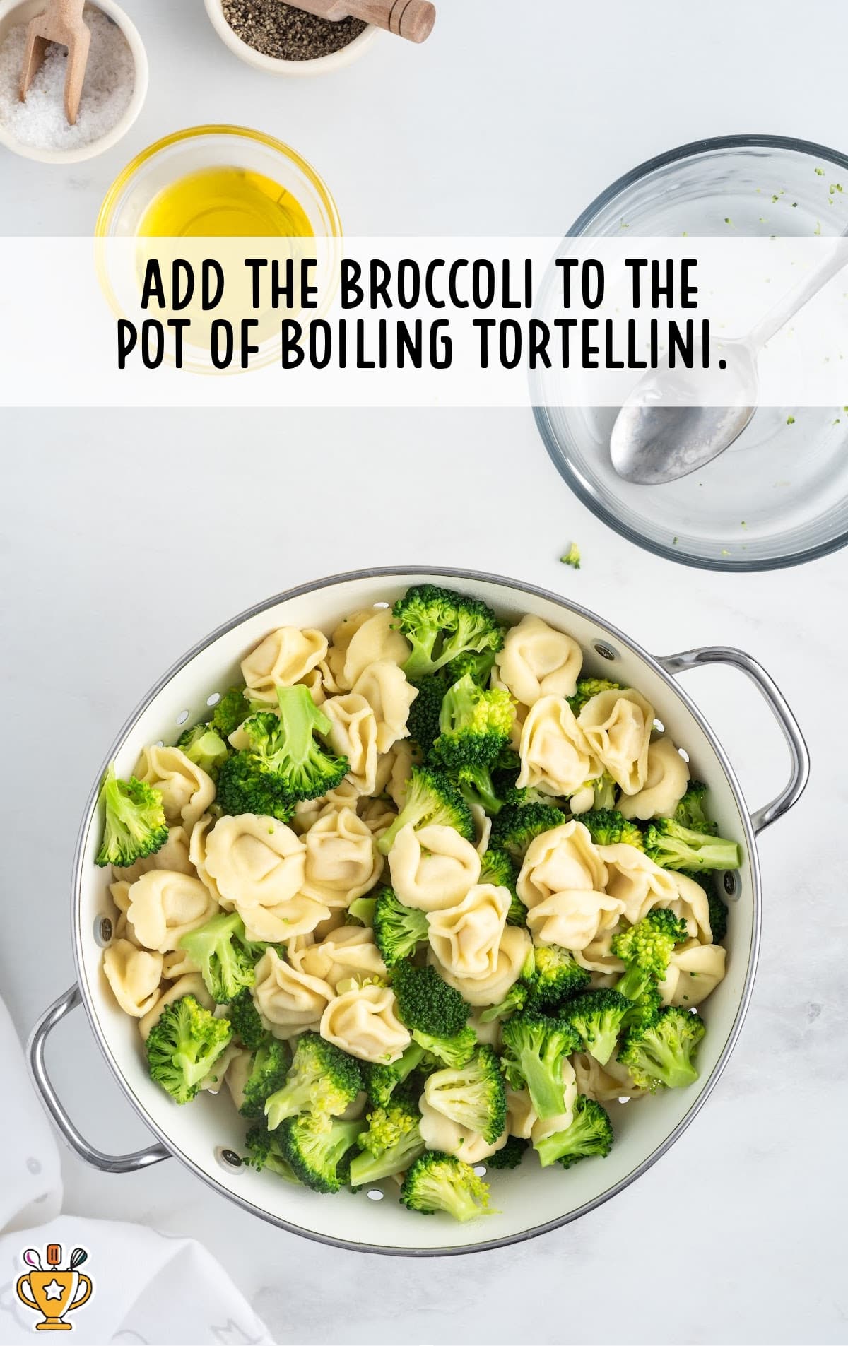 broccoli added to the pot of boiling tortellini