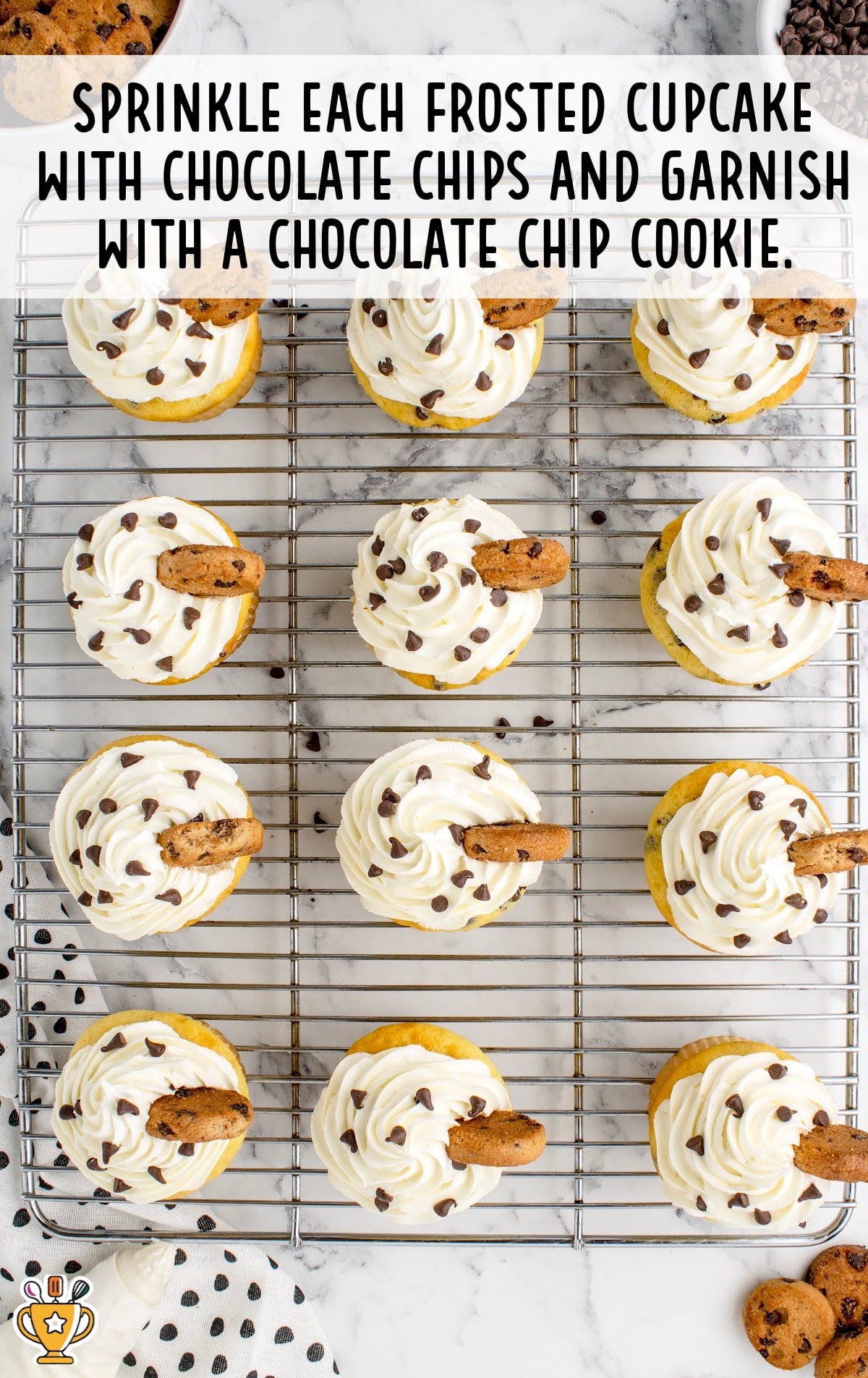 chocolate chips sprinkled on top of the cupcake and garnished with mini chocolate chip cookie