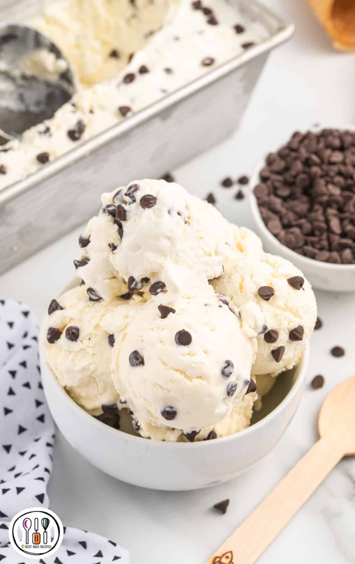 close up shot of scoops of Cookie Monster ice cream in a white bowl