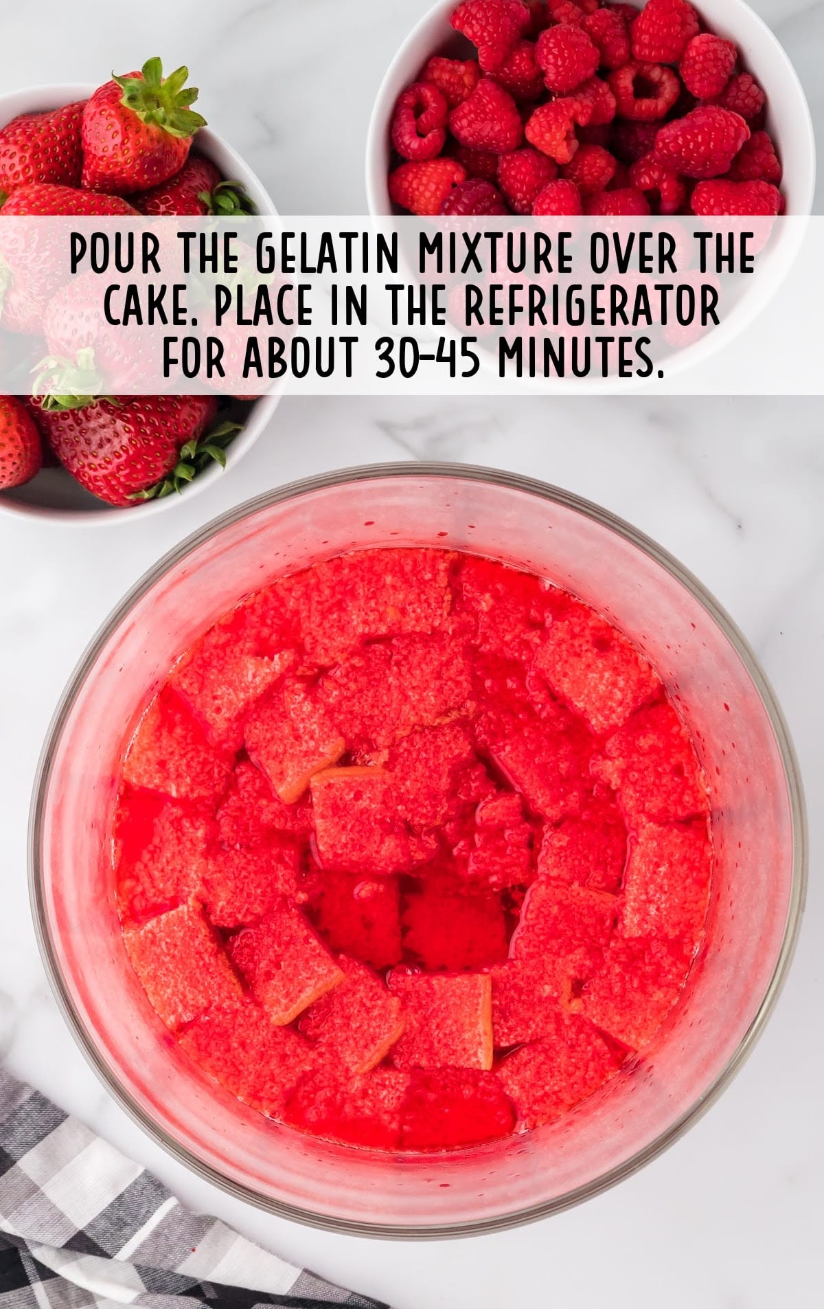 red gelatin mixture poured over top of the cake layer