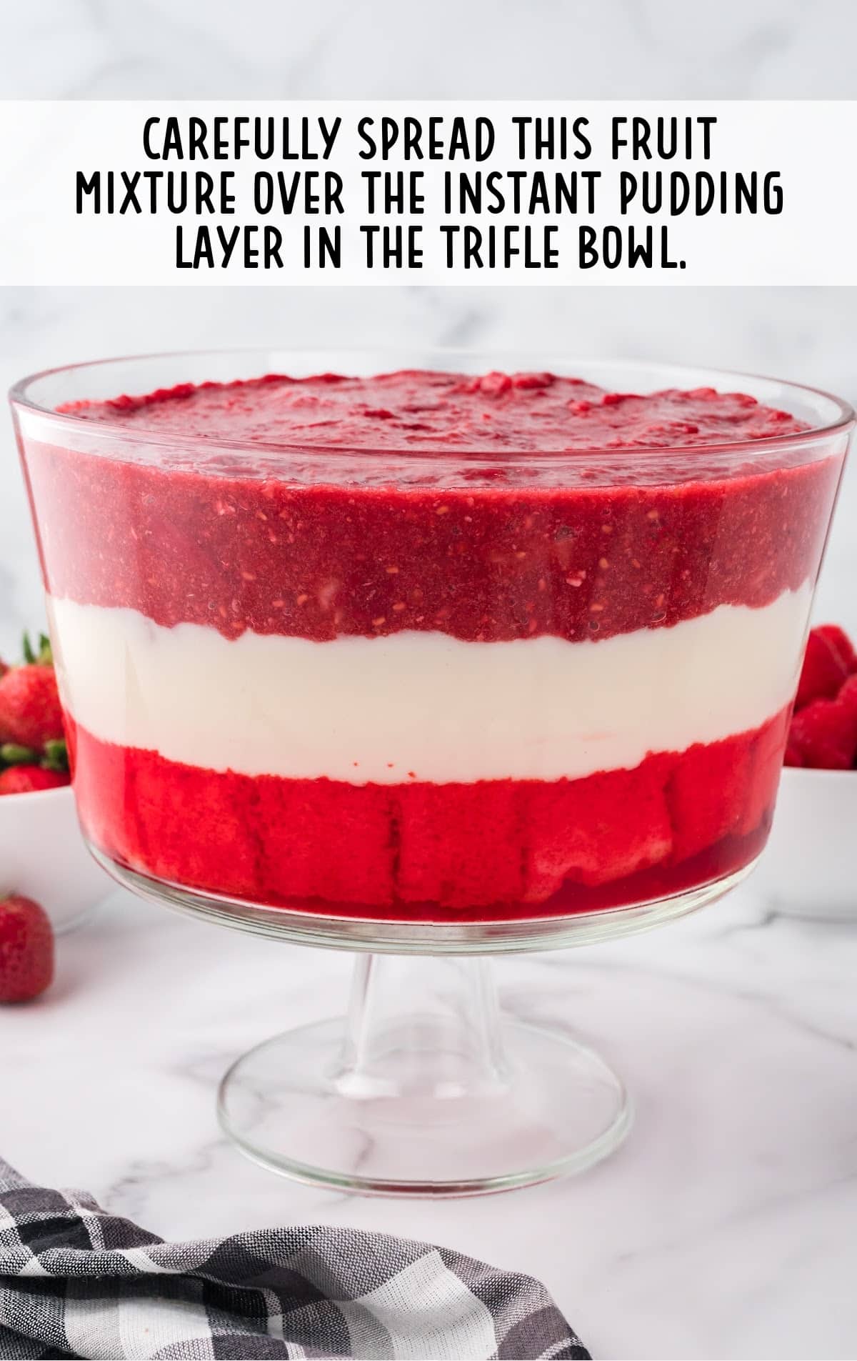 fruit mixture spread over the instant pudding layer in the trifle bowl