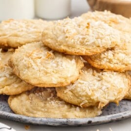 A serving plate of cookies with coconut flakes