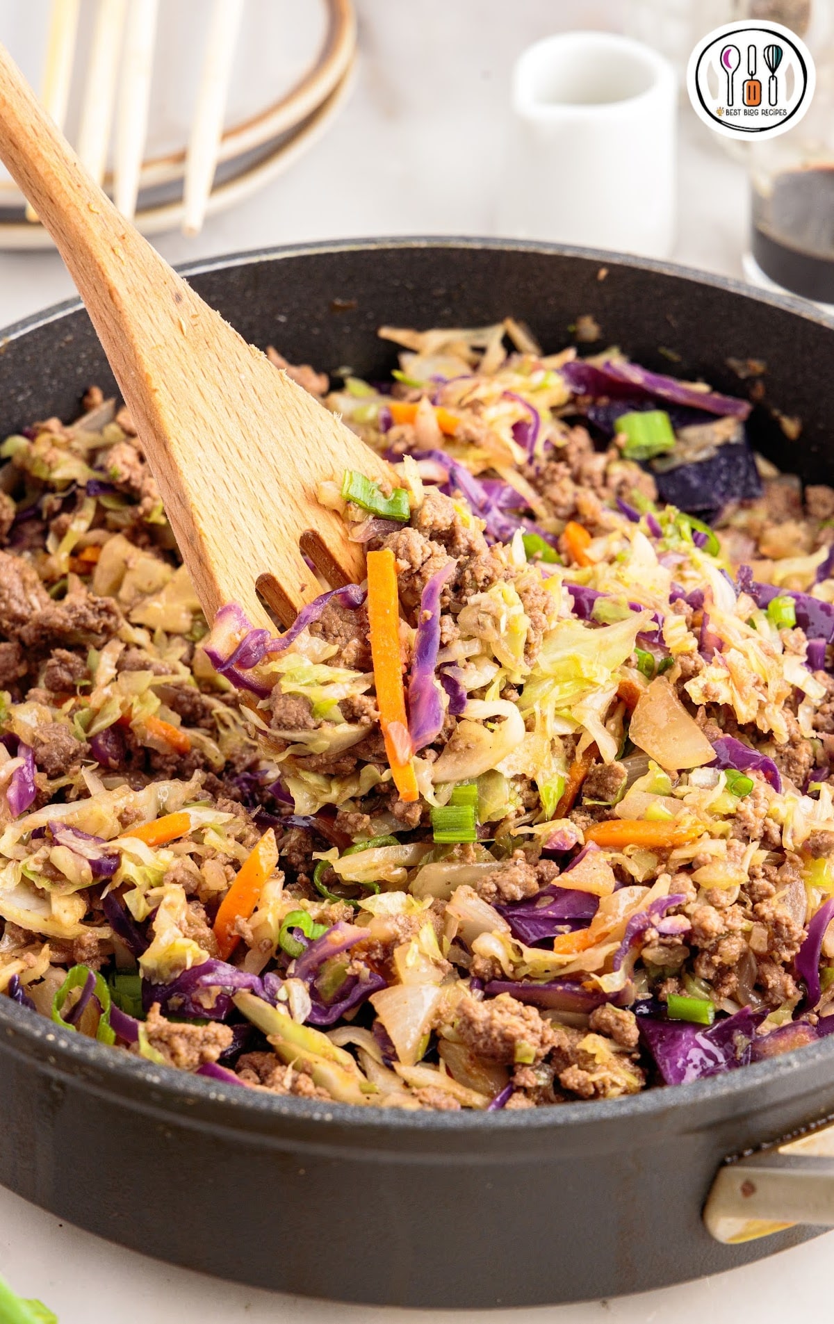 Crack slaw in a pan with a spoon