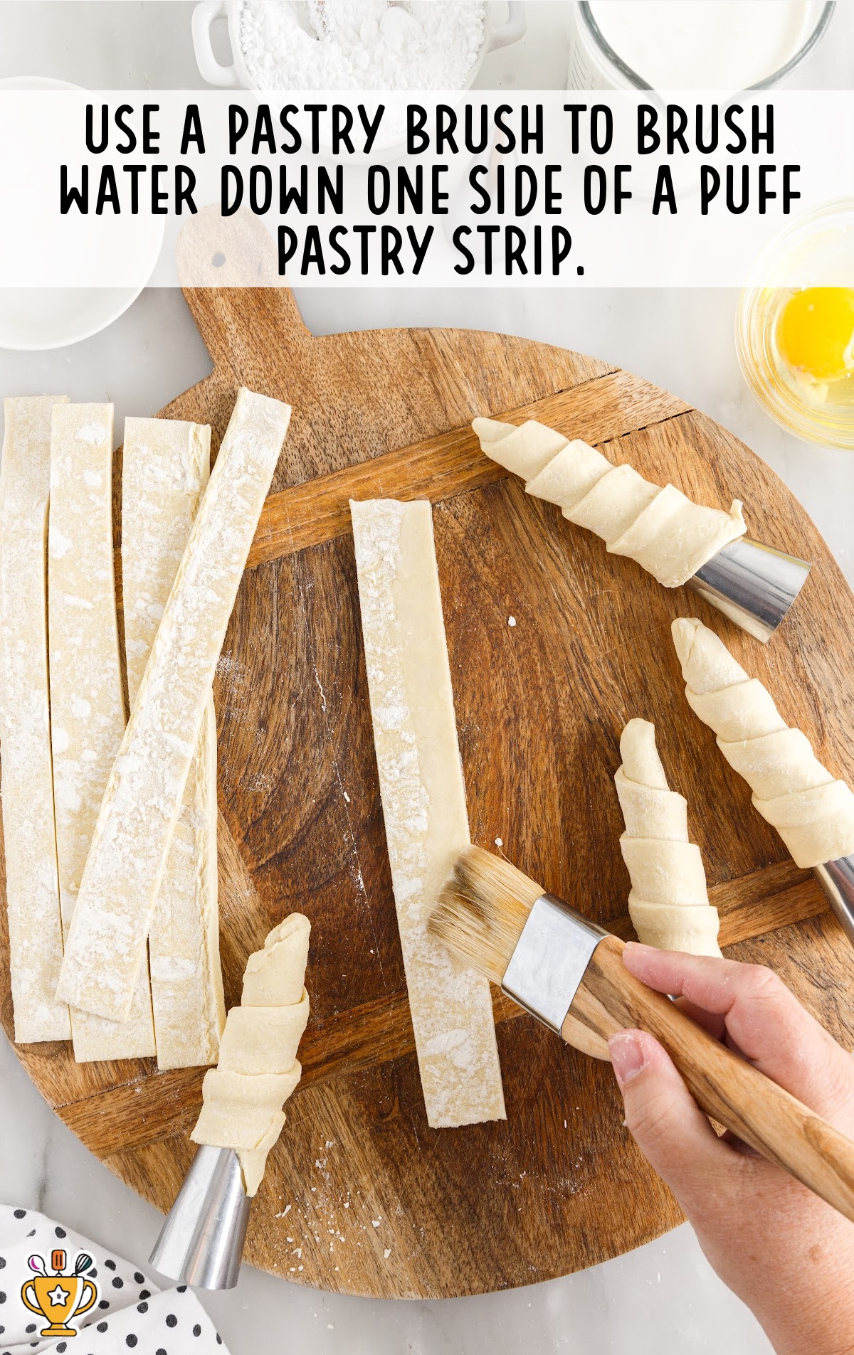 use pastry brush to brush water down the sides