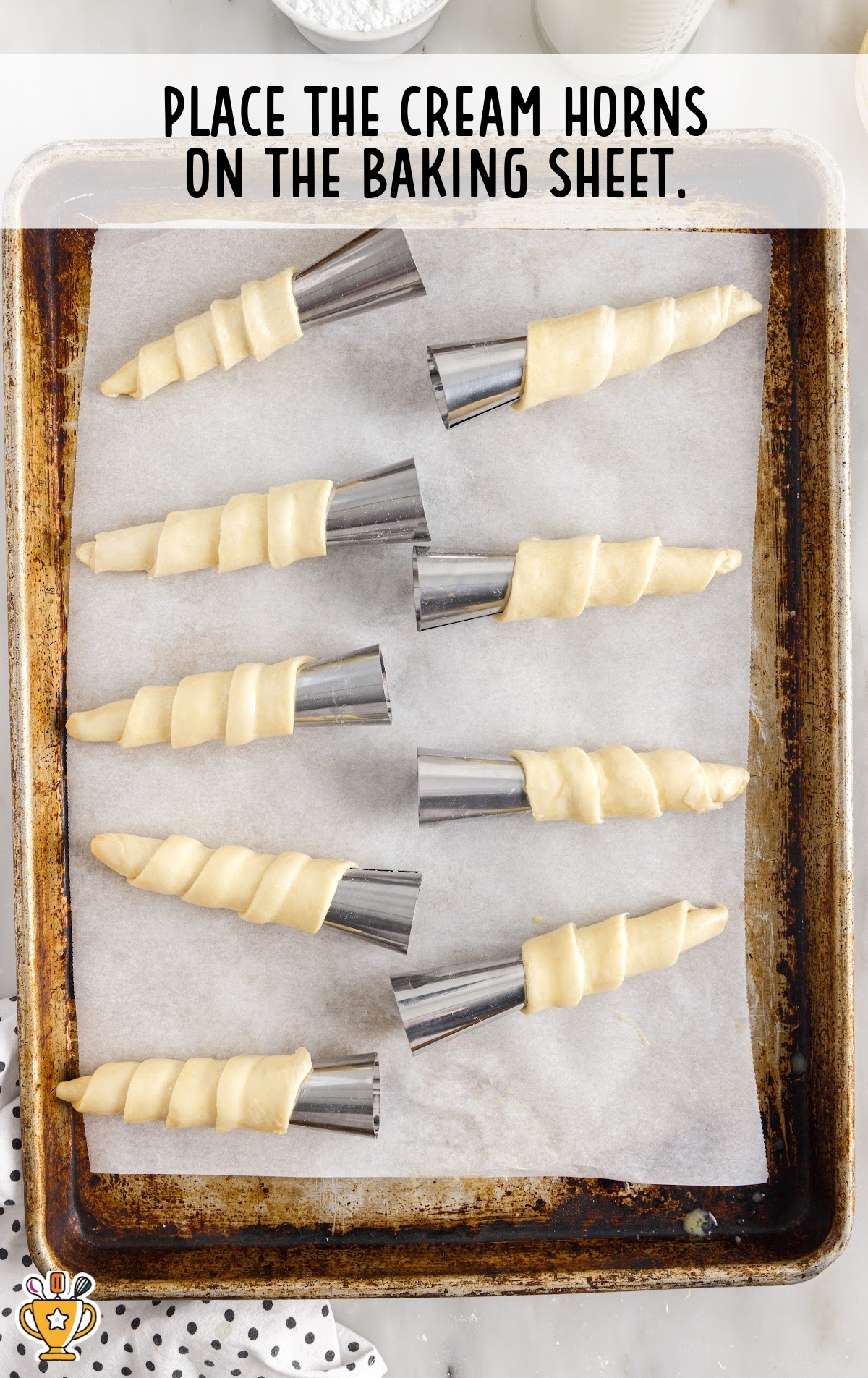 cream horns placed in a baking sheet