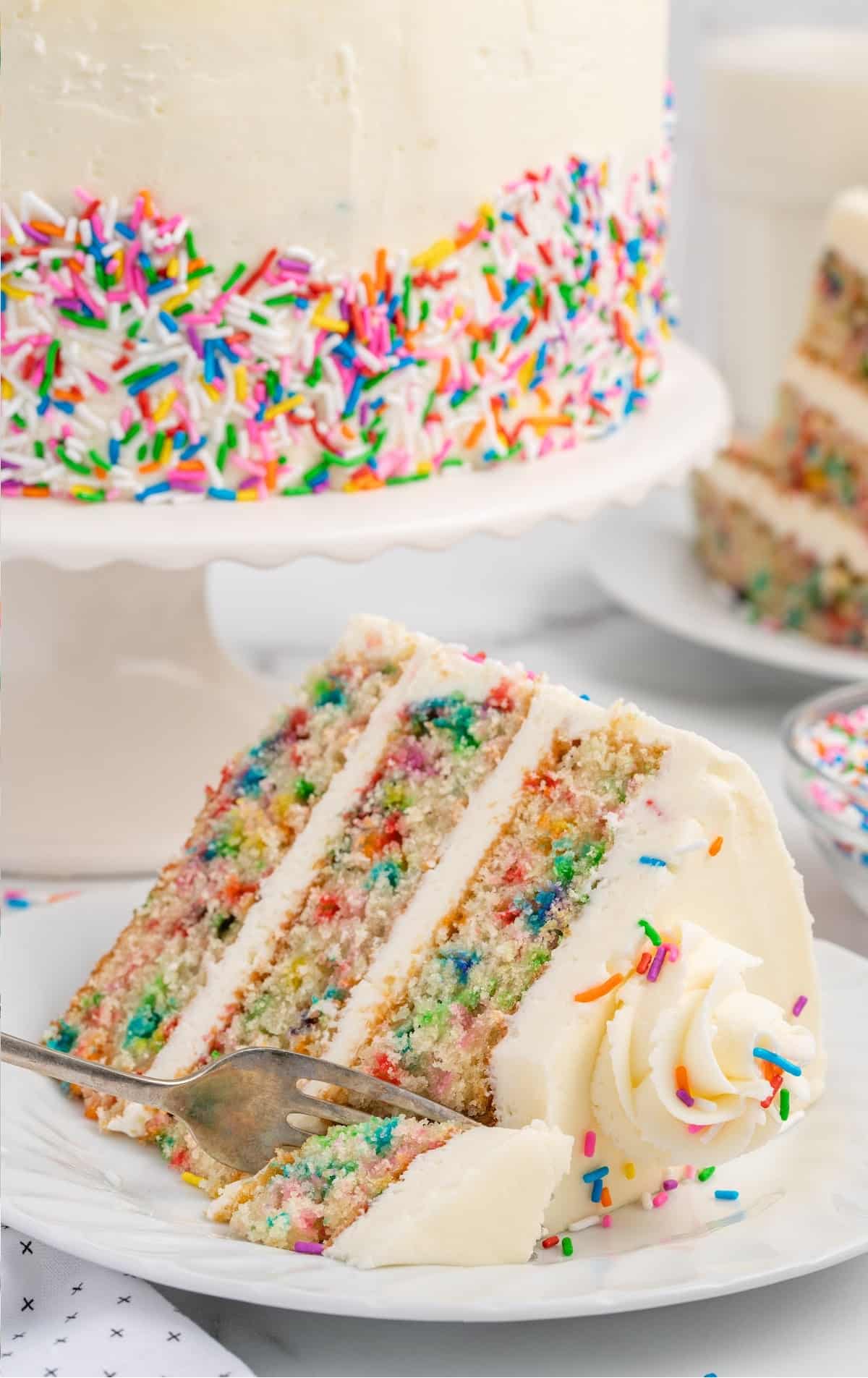 a slice of Funfetti Cake on a plate