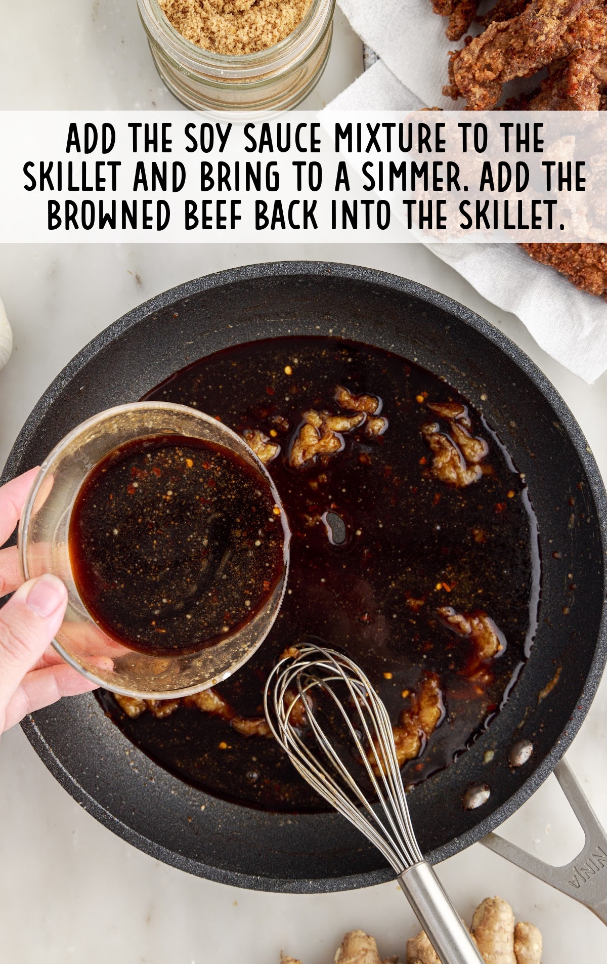 soy sauce mixture added to the skillet and browned beef added back