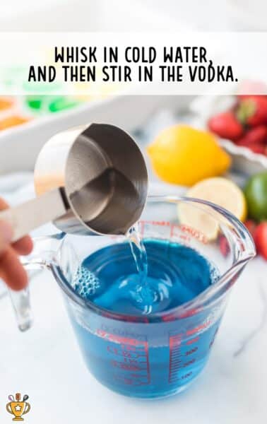 vodka and cold water being added to the hot jello mixture