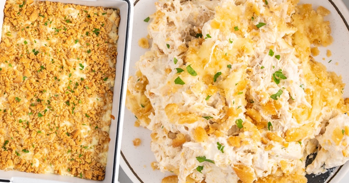 overhead shot of Corn Casserole on a baking dish with a spoon taking out a piece