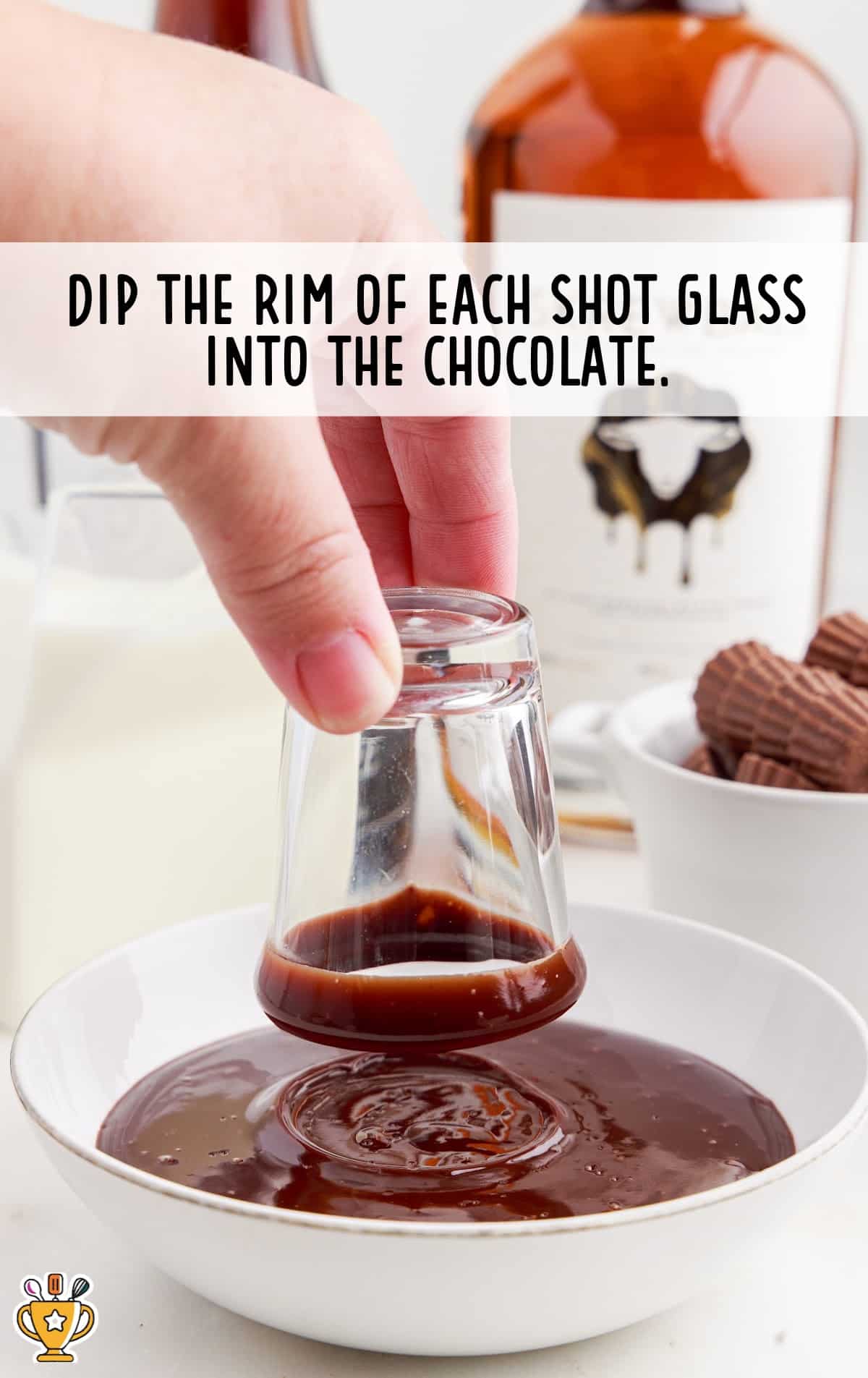 shot glass rim dipped in to the melted chocolate